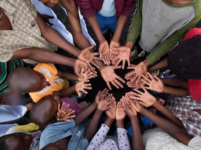 Children hands coming together in a circle